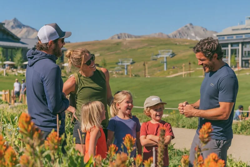 A family meeting a guide in the mountains